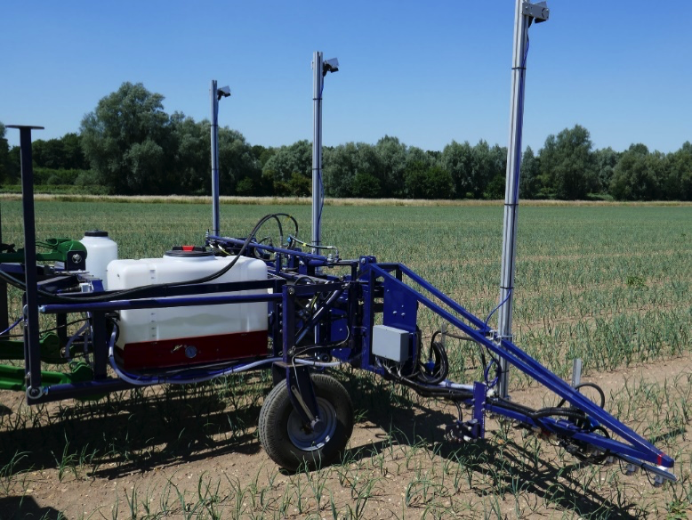 Steered wheels guide our own design of experimental spot sprayer mounted on a parallelogram floating frame